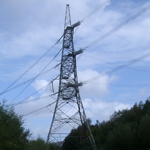 UK: Huddersfield Narrow Canal, passing under a pylon near Staleybridge [Picture by Howard Fisher]