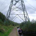 UK: Huddersfield Narrow Canal, passing under a pylon near Staleybridge [Picture by Howard Fisher]