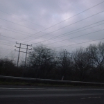 M1, UK: Wires cross between pole and pylon on the route between London and Birmingham [Picture by Flash Wilson]