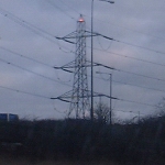 M1, UK: Pylon with light, near airport on the route between London and Birmingham [Picture by Flash Wilson]