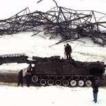 Soldiers clear and repair pylons after the Canadian ice storm of 1998. [Photo courtesy of DND/CF - Photographer (Retired) - Cpl. Sullivan]