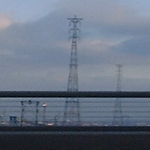 Thurrock, UK: Pylons cross the Thames. Both sides of the crossing can be seen. [Picture by Flash Wilson]